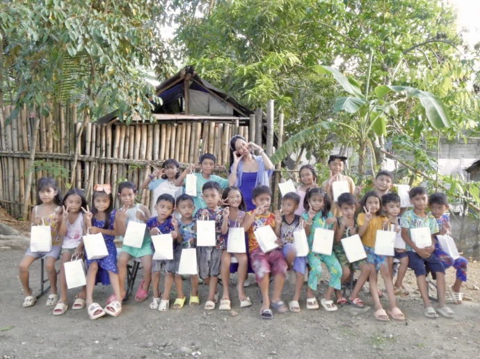 Children receiving shirts and socks